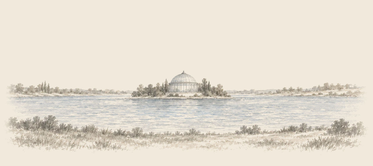 A broad lake with a small island in the middle almost covered by a great glass-domed building, among trees, seen across the water from the shore.