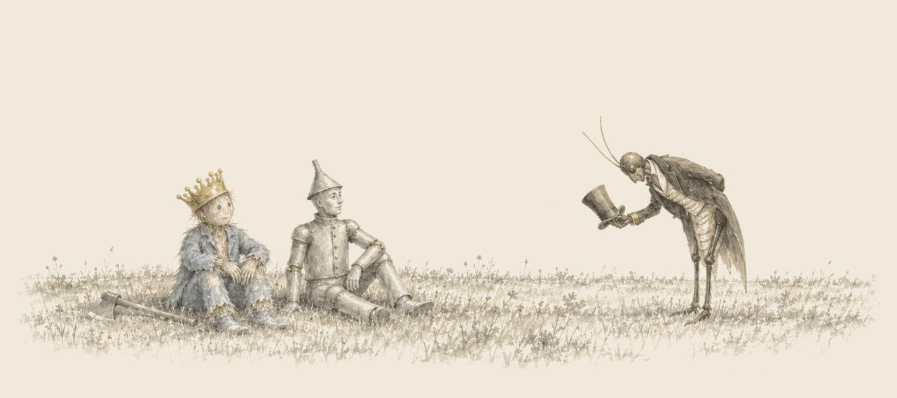 The crowned Scarecrow and the Tin Woodman sit on the grass as the Woggle-Bug, man-sized, bows low before them with his top hat in his hand.