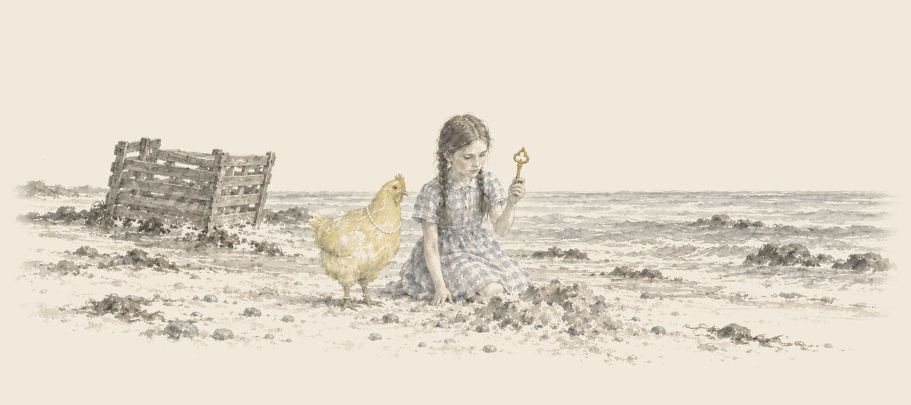 Dorothy kneels on a sandy beach holding up a golden key she has dug up, with Billina the yellow hen beside her and the wrecked coop behind.