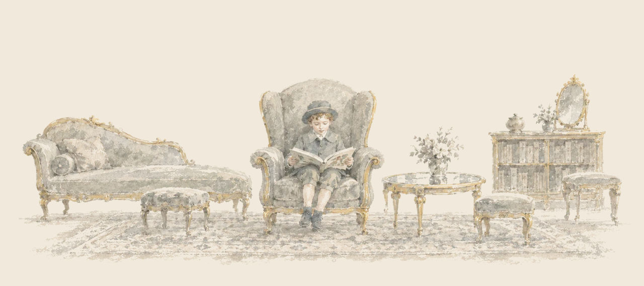 Ojo sits alone in a big armchair with a picture book open on his knees, among the divan, stools, table and bookcase of a fine room.