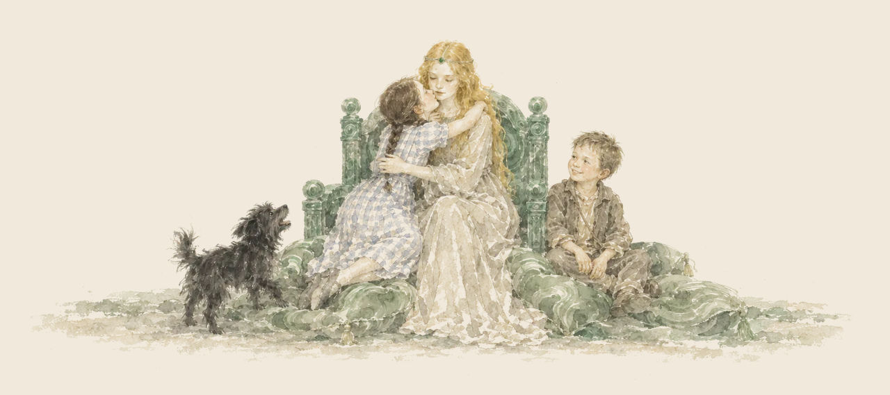 Ozma sits on a carved green throne among cushions, with Dorothy kissing her cheek, Button-Bright smiling beside them and Toto barking at their feet.