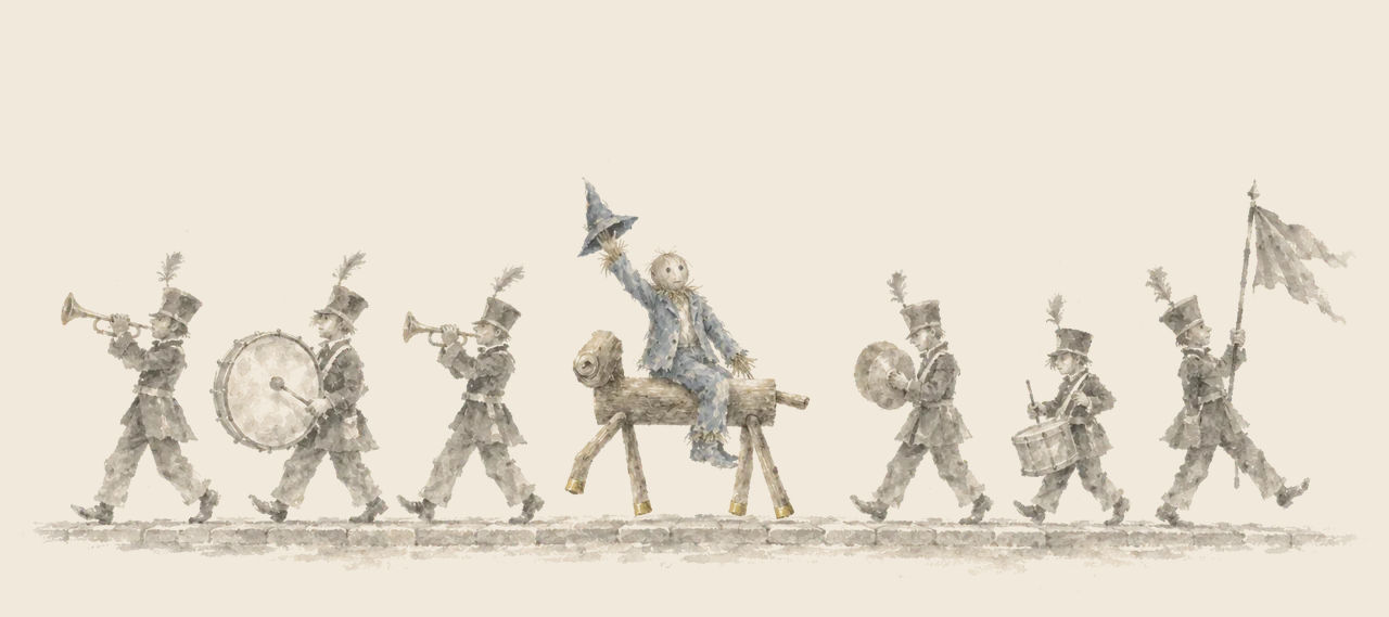 Musicians in plumed hats march along a street with trumpets, drums and a flag, while the Scarecrow rides the Sawhorse and waves his hat.