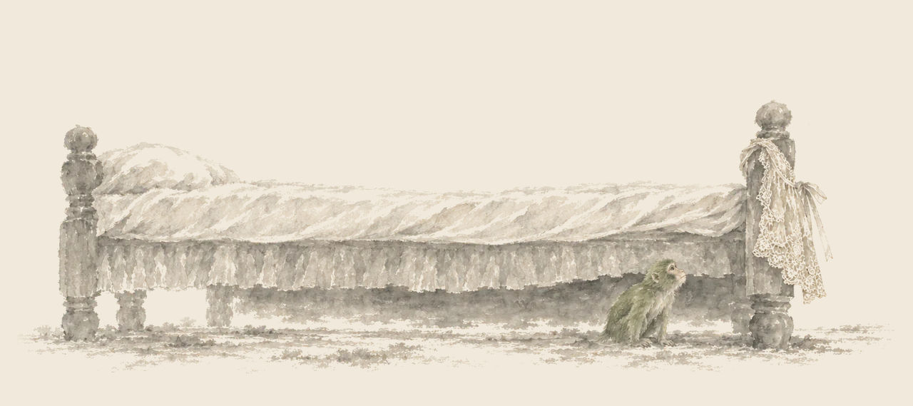 A small green monkey crouches under a giant's bed and looks up at a lace apron hanging from the bedpost.