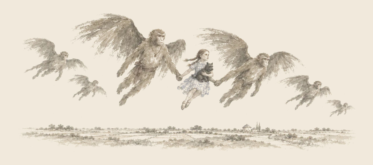 Winged Monkeys fly over a distant country, and Dorothy, holding Toto, is carried between two of them by her hands.